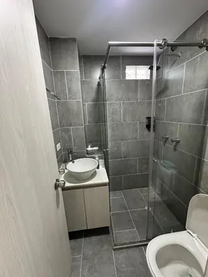 a bathroom with a shower and a sink and a toilet at Comfortable apartment in Sabaneta in Sabaneta