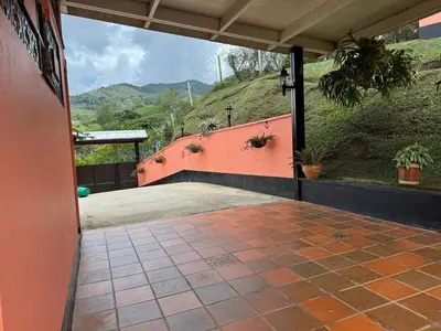 a view from the outside of a house with a patio at Countryside house with jacuzzi and Sauna in Jericó