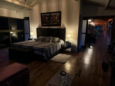 a bedroom with a bed and a couch at Countryside house with jacuzzi and Sauna in Jericó
