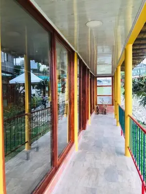 a hallway of a building with large glass windows at Perla del Ruiz in Manizales