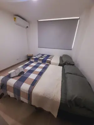 a bedroom with a large bed in a room at Luxury apartment citadela di sole , santafe de antioquia in Santa Fe de Antioquia