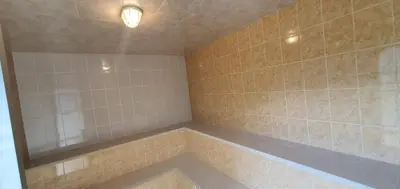 a bathroom with a tub with a light in it at ENTRE LOMAS GLAMPING - Finca el Reposo in Girardota