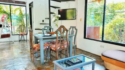 a room with a blue table and two chairs at cabaña in Honda