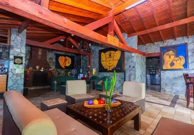 a living room with a couch and a table at Finca Hotel Santo Tomas Campestre in Rionegro
