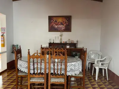 a dining room with a table and chairs at La casa de la abuela in Jericó
