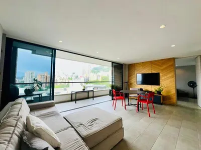a living room with a couch and a table at The best location in Poblado Air conditioning in Medellín