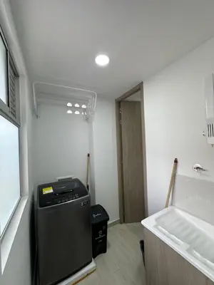 a laundry room with a dishwasher and a sink at céntrico y acogedor apartamento in Sabaneta