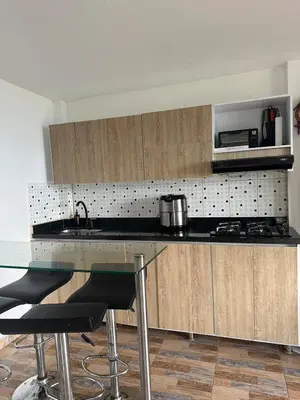 a kitchen with a counter with a sink and a microwave at Casa Campestre in Santa Bárbara