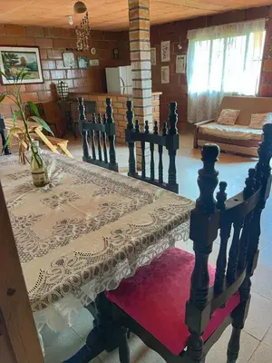 a living room with a table and a couch at FINCA ARCANOS CELESTe in Barbosa