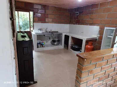 a kitchen with a sink and a brick wall at FINCA ARCANOS CELESTe in Barbosa