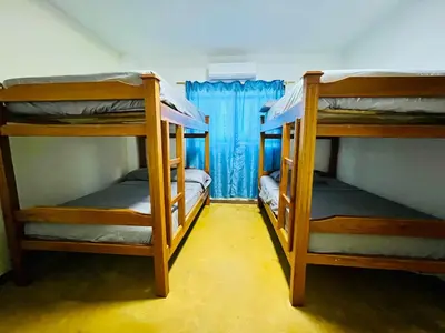 a room with three bunk beds in a room at Finca Campestre El Patujo in Doradal