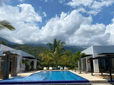 a resort swimming pool with mountains in the background at Finca La Mediterránea en San Jerónimo in San Jerónimo