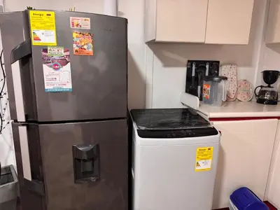 a kitchen with a refrigerator and a stove at Nice place to stay in Medellín