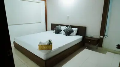 a bedroom with a bed with a basket on it at Oru Forest Retreat & Eco Lodge, just 15 minutes from the airport in Envigado