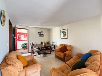 a living room with a couch and chairs and a table at Cantabria in Manizales