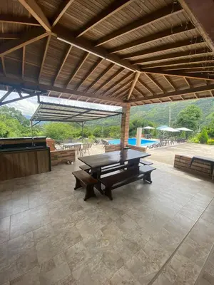 a ping pong table in the middle of a patio at Finca Villa Andrea 1h20min desde Medellín Niquía in Santa Rosa de Osos