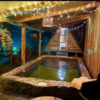 a hot tub in the middle of a house at Glamping Resort Jonico Finca in Chinchiná