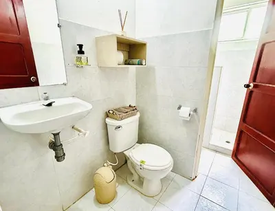 a bathroom with a toilet and a sink at Almalu Finca in Filadelfia