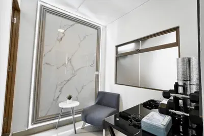 a room with a desk and a chair and a window at El Poblado 4 Bedrooms 2 Baths Private Terrace in Medellín