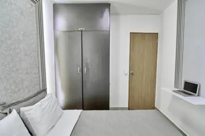 a bedroom with a bed and a sliding door at El Poblado 4 Bedrooms 2 Baths Private Terrace in Medellín