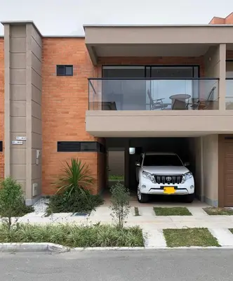 a car parked in the garage of a house at Casa en San Antonio de Pereira in Rionegro