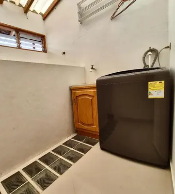 a kitchen with a black refrigerator in a room at Apartamento central en Guatape - 2 habitaciones - 2 baños - Ideal familias in Guatapé