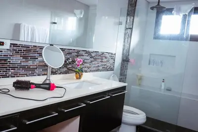 a bathroom with a sink and a mirror on a counter at VILLA DOLLS PRIVADA CON SAUNA, PISCINA Y MAs in Rionegro
