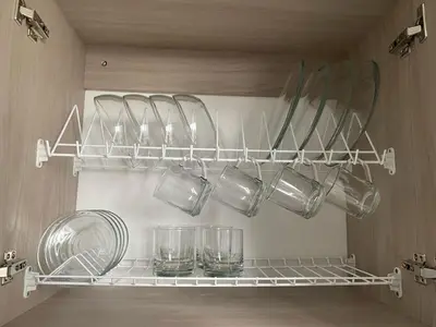 a shelf with glasses and bowls on it in a kitchen at Apartamento en Manizales in Manizales