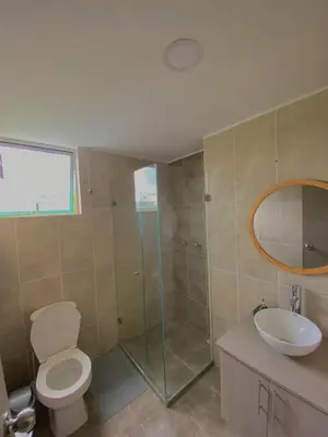 a bathroom with a toilet and a sink and a shower at Apartamento en Manizales in Manizales
