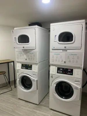three washing machines stacked on top of each other at Apartamento en Manizales in Manizales