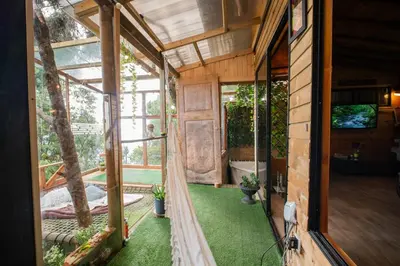 an outside view of a house with a garden at Cabaña in Medellín