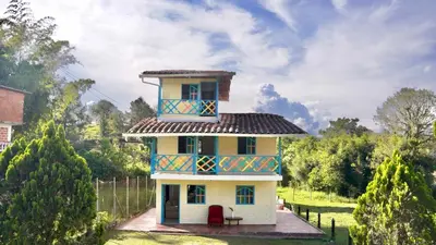 a house with a tower on top of it at Casa Guatapé in Guatapé