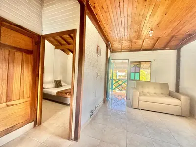 a living room with a couch and a bed at Casa Guatapé in Guatapé