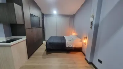 a bedroom with a bed in a small room at Casa 1982 in Manizales