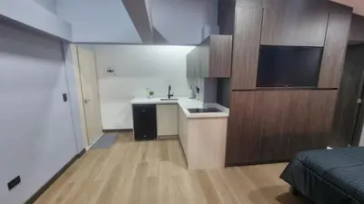 a small kitchen with a sink and a counter at Casa 1982 in Manizales