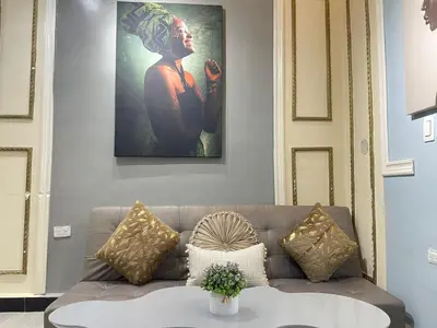 a living room with a couch and a table at apartamento duplex la 70 estadio laurles in Medellín