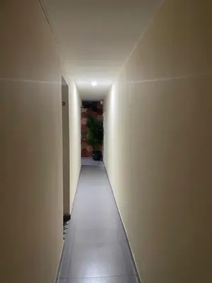 an empty hallway with a corridorngthngthngthngthngthngthngthngth at apartamento duplex la 70 estadio laurles in Medellín