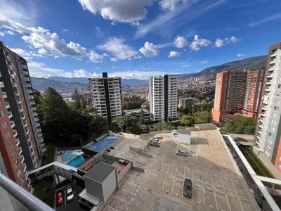 a view of a city with buildings and a pool at Apartment in Envigado with a pool in Envigado