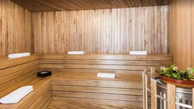 a sauna with wooden walls and a wooden floor at Aparta Suite Hotel Rioverde Aeropuerto JMC in Rionegro