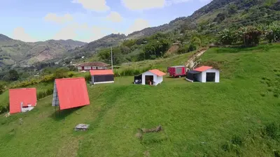 a group of houses on top of a hill at Stone's chalets Guatapé in Guatapé