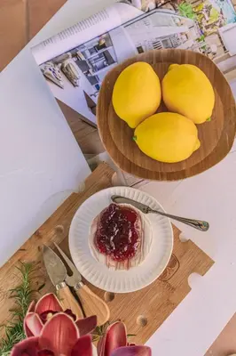 two plates of fruit and a plate of jam on a table at Vista Bonita - Hacienda Guatape in Guatapé