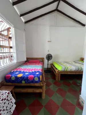 a room with two beds in a room at Famihotel Asturias in Hispania
