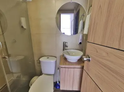 a small bathroom with a toilet and a sink at Apartaestudio S201 a 2 calles Milán Urbanevo in Manizales