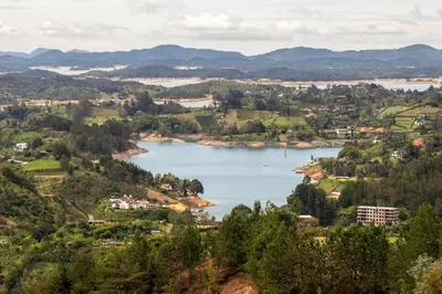 a view of a large lake in a valley at Luxury Guatapé Loft with Starlink WiFi & Jacuzzi in Chiquinquirá