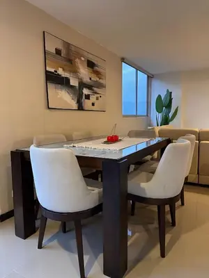 a dining room with a table and chairs at 23rd Floor Luxury Apartment 5 Min from Provenza in Medellín