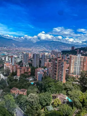 a view of a city with tall buildings and trees at 23rd Floor Luxury Apartment 5 Min from Provenza in Medellín
