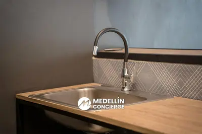 a kitchen sink with aethlin conference sign on it at 2BR House Jacuzzi & AC in Poblado Manila in Medellín
