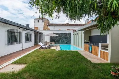 a backyard of a house with a swimming pool at Villa Armonía - Santa Fé de Antioquia in Santa Fe de Antioquia