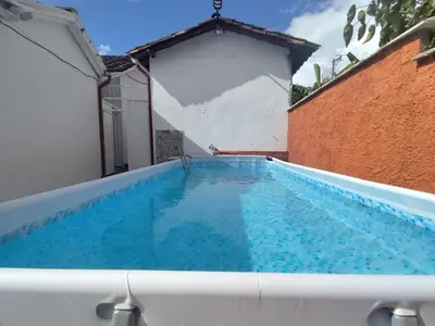 a swimming pool in the middle of a building at Encanto colonial in Sopetran