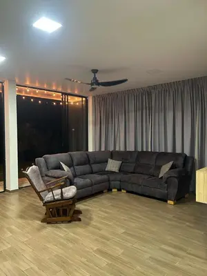 a living room with a couch and a chair at Villa Los Pinos in Sopetran